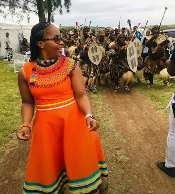 Clipkulture | Lady In Orange Patterned Zulu Dress, Beaded Choker and Cape